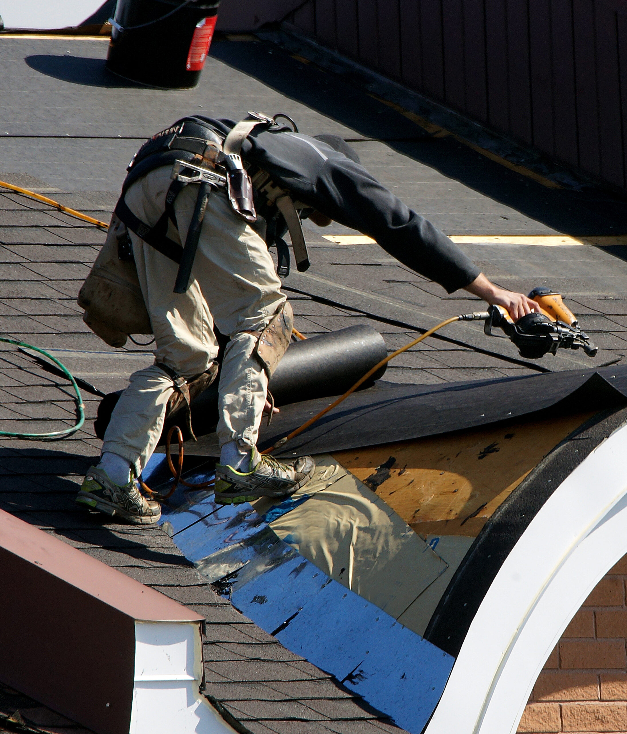 Men laying new roof